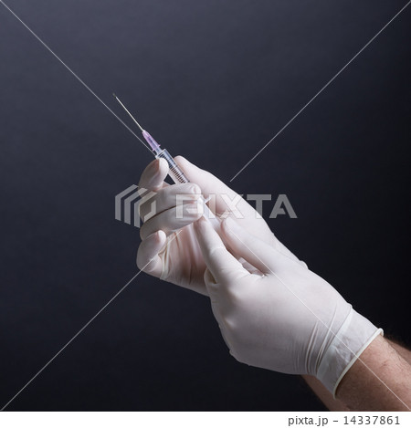 Hands with syringe 14337861