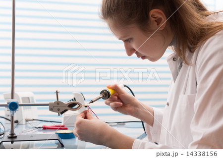 Girl Solder and adjust Electronic Device Girl Solder and adjust Electronic Device 14338156