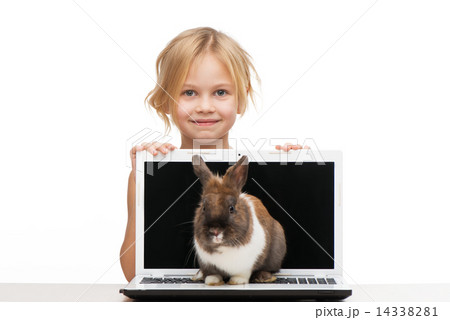 Little girl with laptop and bunny on it 14338281