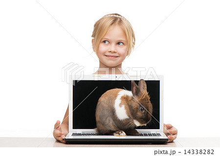 Girl with laptop and little bunny on it 14338282