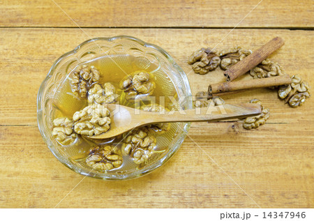 Walnuts honey and lemon on a table 14347946