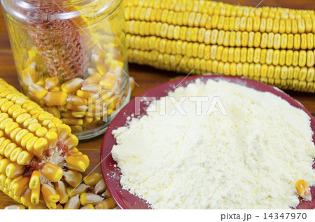 A jar with corn, flour and corn ear 14347970