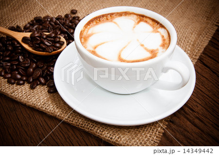 Coffee cup and saucer on a wooden table 14349442