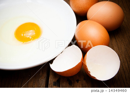 broken chicken eggs and egg yolk broken chicken eggs and egg yolk 14349460