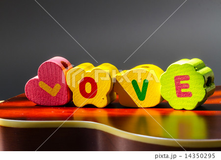 vintage style of Love concept : The word love on the wooden floor with effect from the sun shines 14350295