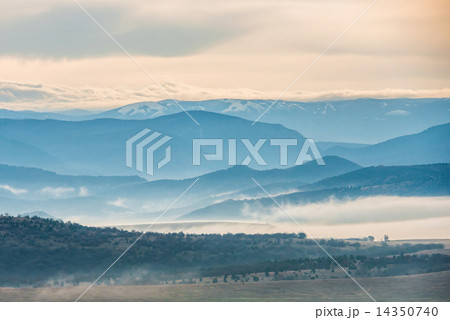 Blue mountains covered with mist 14350740