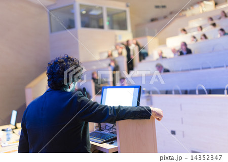 Speaker giving talk on podium at Business Conference. 14352347