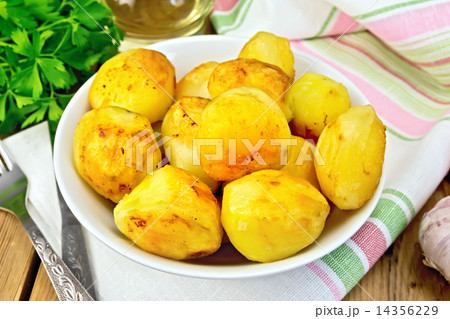 Potatoes fried in plate on fabric 14356229