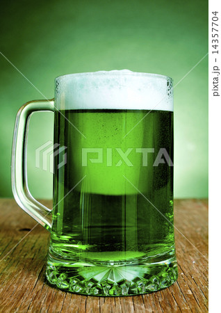 glass mug with dyed green beer 14357704
