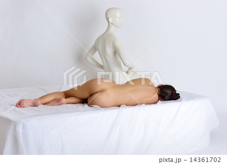 Naked woman laying on the bed with mannequin. Naked woman laying on the bed with mannequin. 14361702