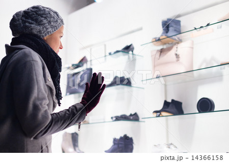 Woman window shopping. Woman window shopping. 14366158