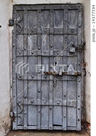 Ancient rusty metal door with padlock Ancient rusty metal door with padlock 14377594