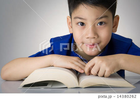 Little asian boy read a book Little asian boy read a book 14380262