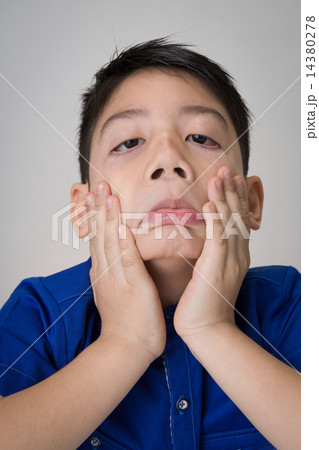 portrait of asian cute boy sad and looking very disappointed portrait of asian cute boy sad and looking very disappointed 14380278