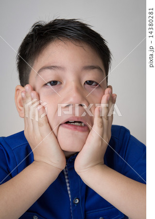 portrait of asian cute boy sad and  looking very disappointed 14380281