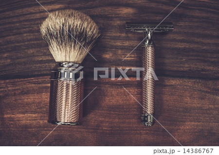 Safety razor and shaving brush on a wooden background 14386767