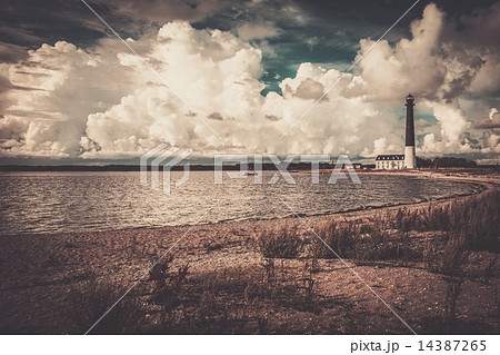 Lighthouse and keeper's house near beautiful bay 14387265