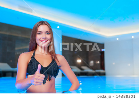 Beautiful woman in luxury swimming pool Beautiful woman in luxury swimming pool 14388301