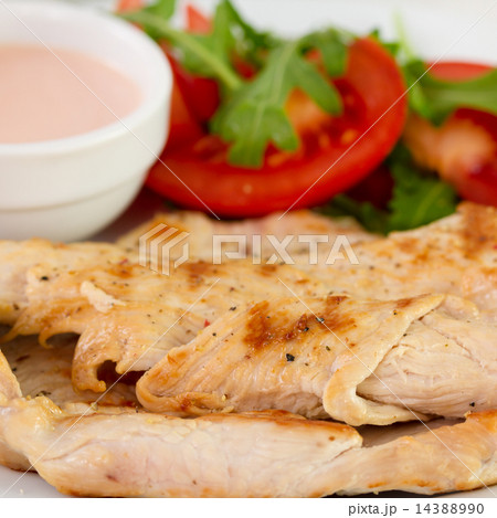 fried turkey with sauce and tomato 14388990