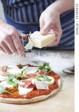 Adding Ingredients To Home Made Pizza Base Adding Ingredients To Home Made Pizza Base 14389829