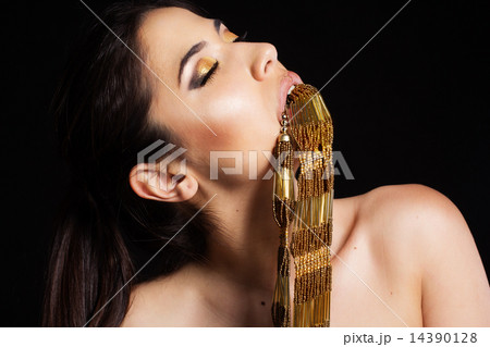 Pretty girl with necklace in her mouth 14390128