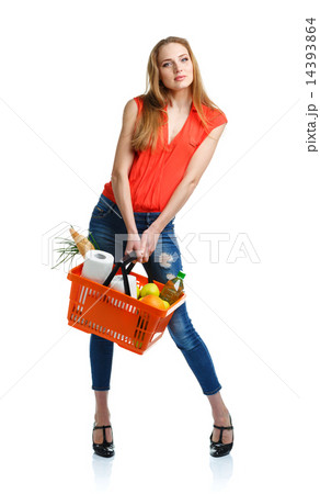 Woman with assorted grocery products in basket Woman with assorted grocery products in basket 14393864