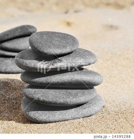 stacks of stones on the sand of a beach stacks of stones on the sand of a beach 14395288