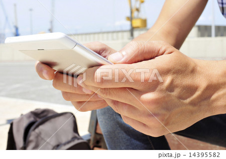 young man using a tablet or an e-book young man using a tablet or an e-book 14395582