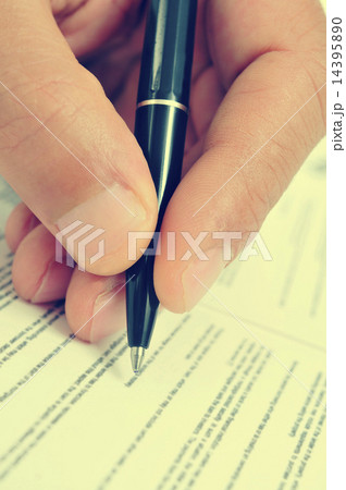 man hand with a pen, with a retro filter effect 14395890
