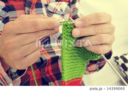young man knitting 14399060