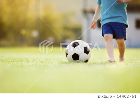 Little boy playing football Little boy playing football 14402761
