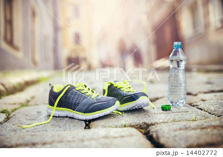 Running shoes and bottle of water 14402772