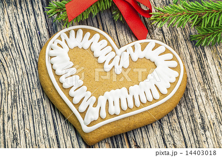 Christmas gingerbread on a wooden table with fir b 14403018