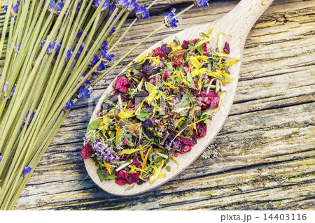 Natural dry herbal tea with meadow flowers near on 14403116