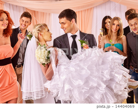Groom carries bride on his hands . Groom carries bride on his hands . 14404069