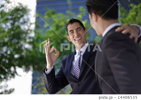 Multi-Racial co-workers in team work collaboration 14406535