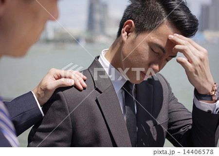 Close up of Counseling a colleague over bad news 14406578