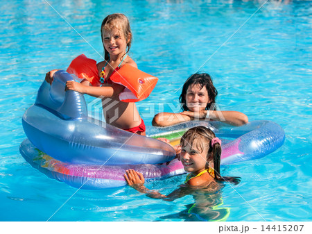 Family in swimming pool. Family in swimming pool. 14415207