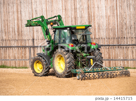 Tractor working on riding place 14415715