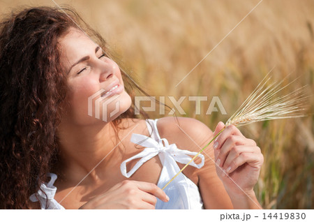 Perfect woman in wheat field on summer day. Picnic. Perfect woman in wheat field on summer day. Picnic. 14419830