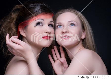 Closeup portrait of two girls: good & evil Closeup portrait of two girls: good & evil 14420069
