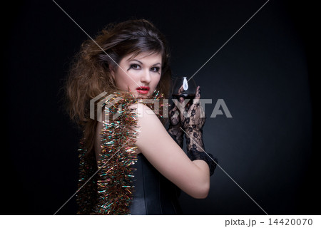 Closeup portrait of girl with red lips, tinsel and wineglass on Closeup portrait of girl with red lips, tinsel and wineglass on 14420070