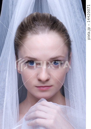 Closeup portrait of beautiful blond girl in white fabric Closeup portrait of beautiful blond girl in white fabric 14420071