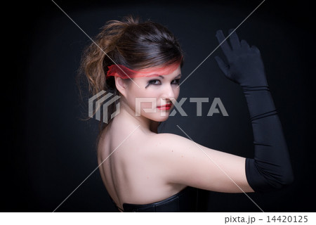 Close up portrait of girl with red lips on black 14420125
