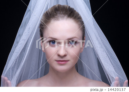 Closeup portrait of beautiful blond girl in white fabric 14420137