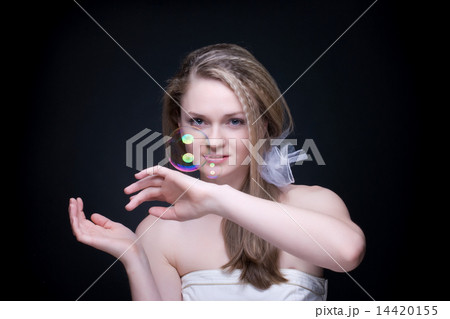 Closeup portrait of blond girl with soap bubbles on black Closeup portrait of blond girl with soap bubbles on black 14420155