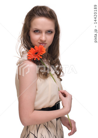 Close up portrait of young beautiful woman with orange flower 14420189