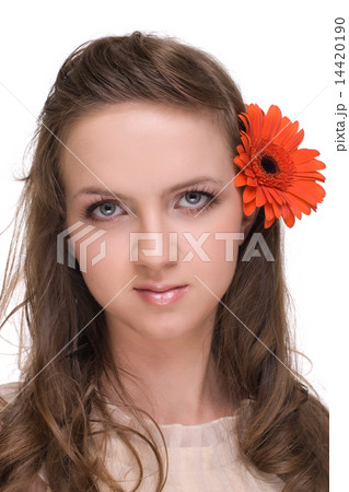Close up portrait of young beautiful woman with orange flower Close up portrait of young beautiful woman with orange flower 14420190