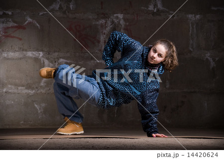 Hip hop dancer in modern style over brick wall 14420624