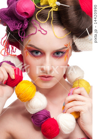Closeup fashion woman with color face art in knitting style 14420990